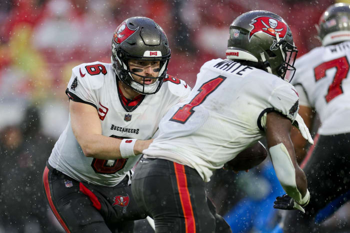 Dec 3, 2023; Tampa, Florida, USA; Tampa Bay Buccaneers quarterback Baker Mayfield (6) hands off to running back Rachaad White (1) against the Carolina Panthers in the second quarter at Raymond James Stadium. Mandatory Credit: Nathan Ray Seebeck-USA TODAY Sports